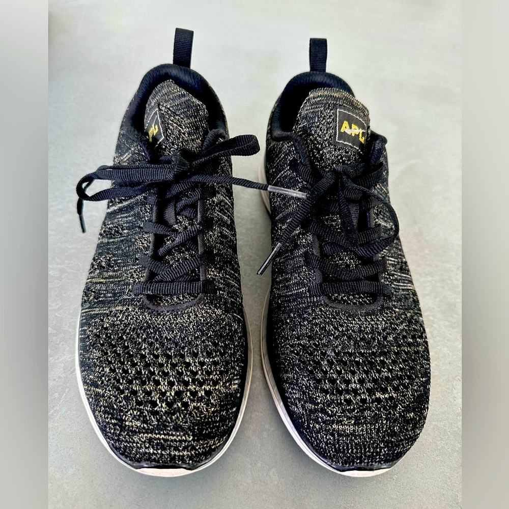 Black and gold APL sneakers